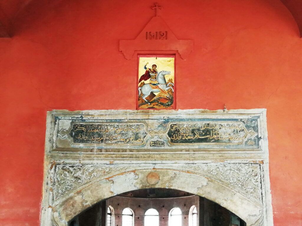 In 1912, an icon of St. George was placed above the Arabic Turkish inscription dating from the dedication of the Mosque