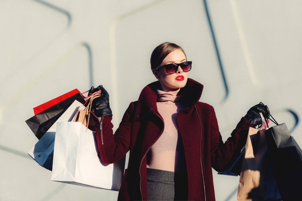 A woman holding many shopping bags - Mega Outlet is a good Thessaloniki Shopping Mall for discounts 